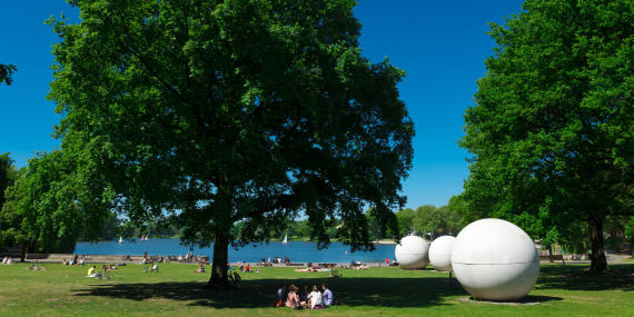 Aasee (lake) with giant pool ball sculptures