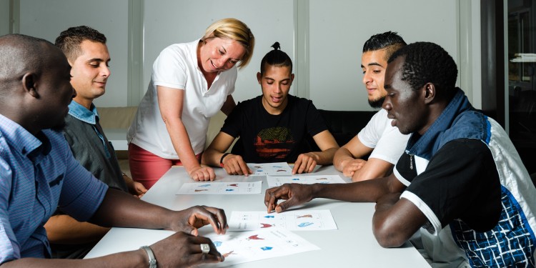 Refugees in a language class.<address>© Adobe Stock/ Frank Gärtner</address>