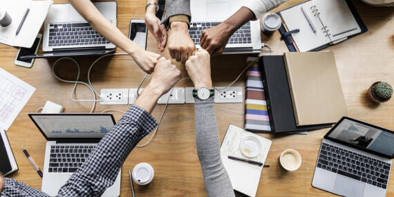 Colleagues giving a fist bump