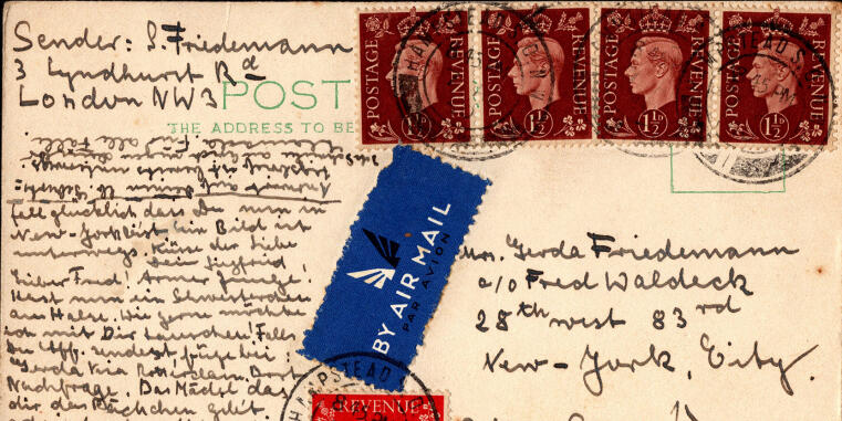 A handwritten postcard with a ‘by Air Mail’ sticker, four stamps and several postmarks.