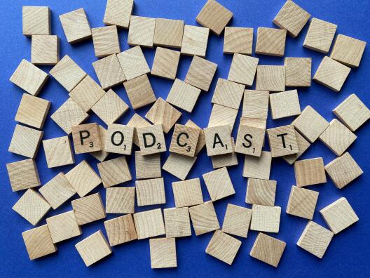Scrabble letters spelling out the word “podcast”