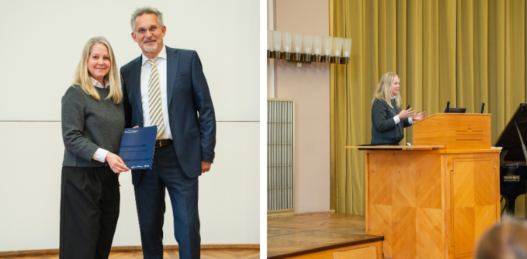 Eine Frau hält ein Dokument. Rechts von ihr steht ein Mann.