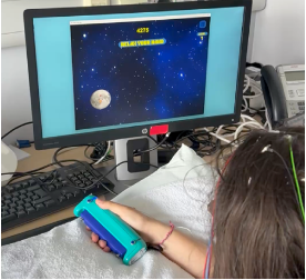Figure 1: Subject taking part to the active grip and neurofeedback study