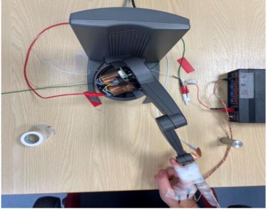 Figure 2: Subject performing index-reaching to a virtual object across different sensory conditions