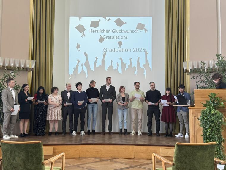 The picture shows 13 PhD students who were awarded doctorates in natural sciences during the graduation ceremony of the Department of Biology.