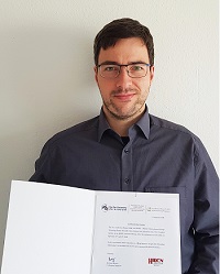 Martin Kolek with certificate