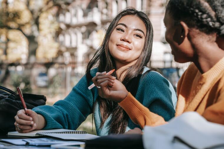 Two international students talking together