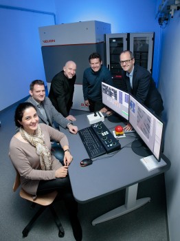 Representatives from the University and from the Raith company in front of the VELION: (from left) Dr. Banafsheh Abasahl, executive director of the Münster Nanofabrication Facility at Münster University, Daniel Bernhardt and Dr. Jörg Stodolka, both from Raith, Prof. Wolfram Pernice from Münster University, and Torsten Richter from Raith. [Note: the picture was taken some weeks ago before the Corona pandemic reached Germany and necessitated social distancing.]<address>© WWU - MünsterView</address>